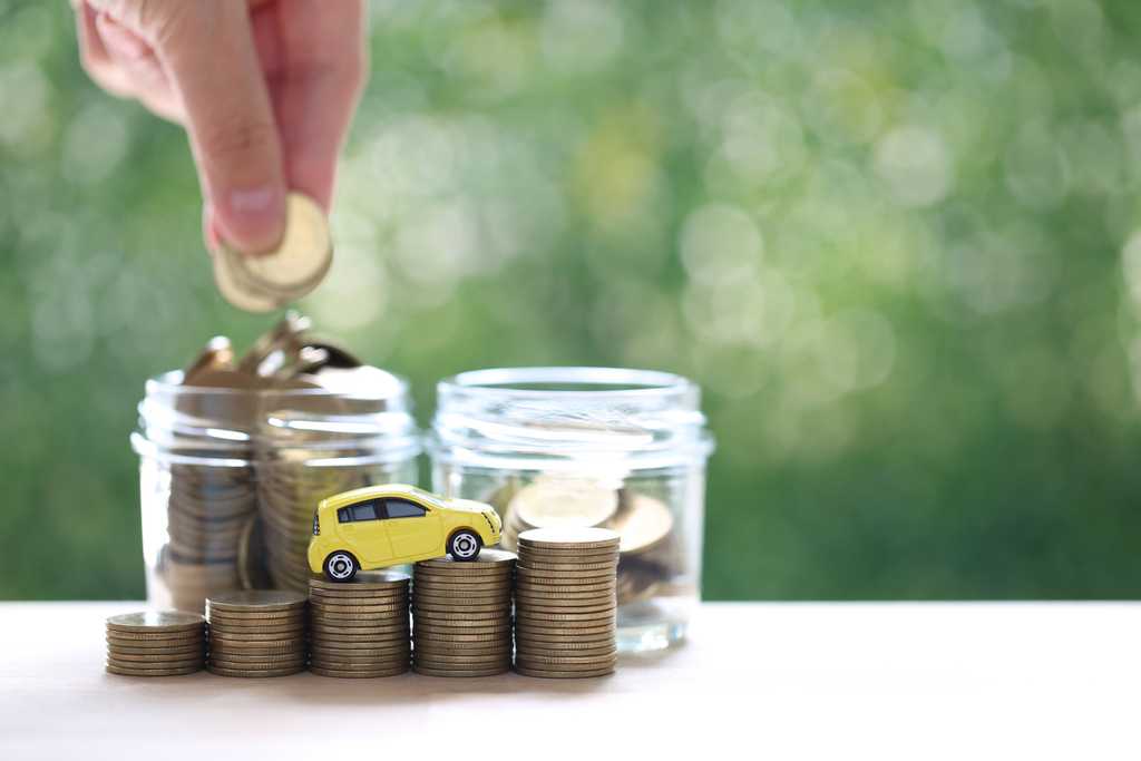 car loan refinance concept, filling 1 jar of money from the other