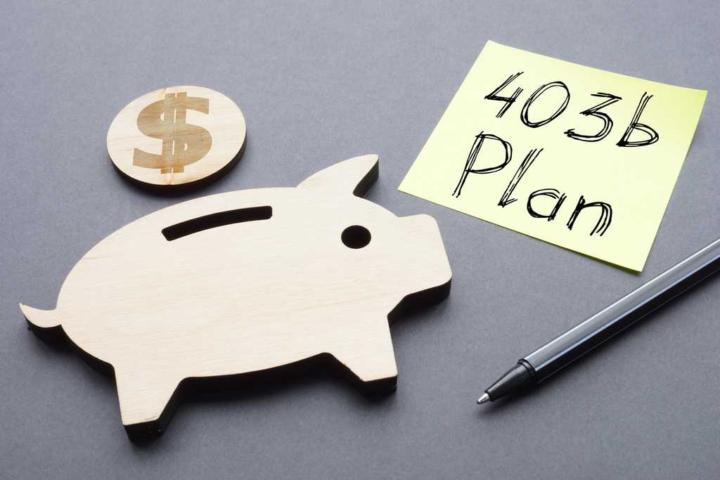 403b plan money next to piggy bank