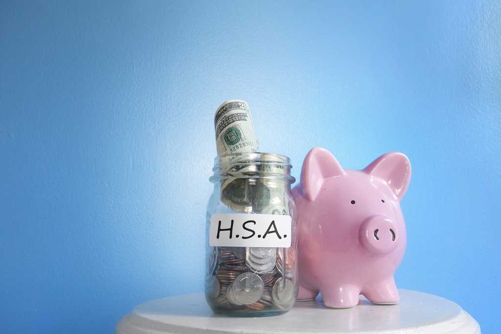 Health Savings Account ( HSA ) coin jar with piggy bank